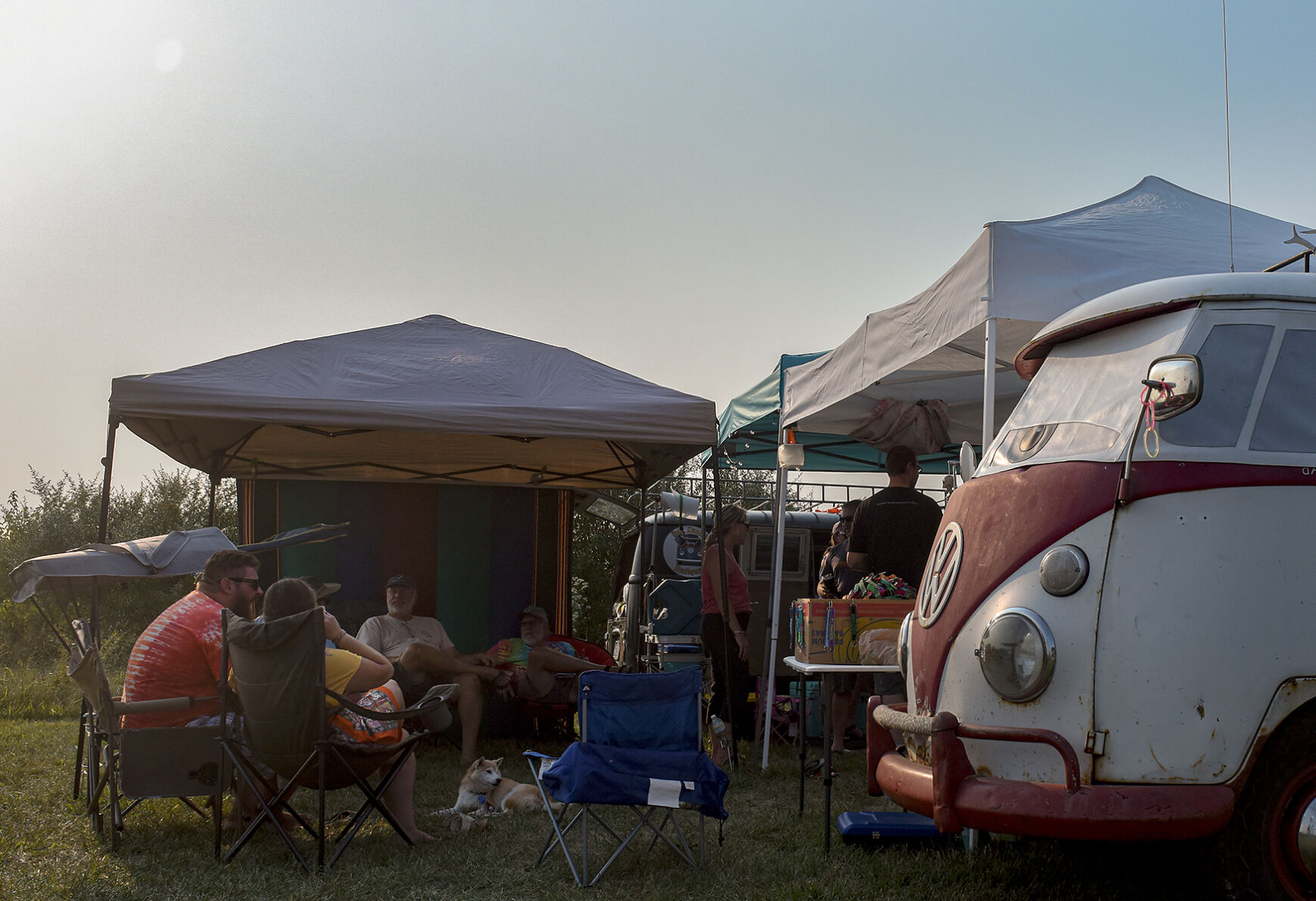 Owners sit under a tent